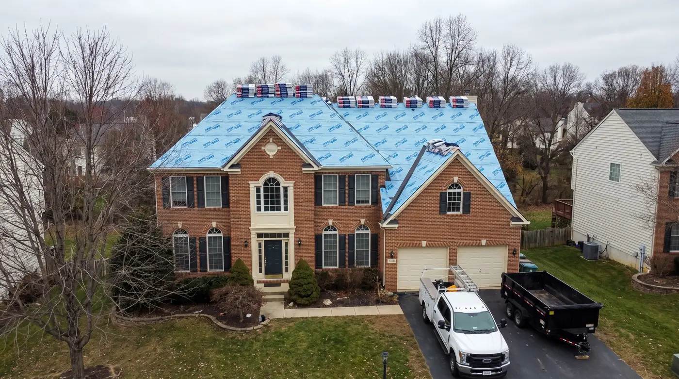 Drone view of a storm-damaged Northern Virginia roof documented for a claim